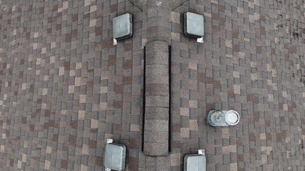 mixed ventilation ridge vent and box vent asphalt shingle residential roof