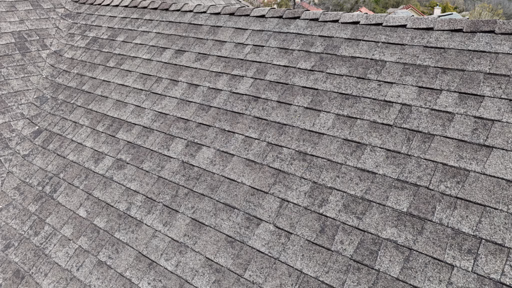 hail damage impact marks on asphalt shingles